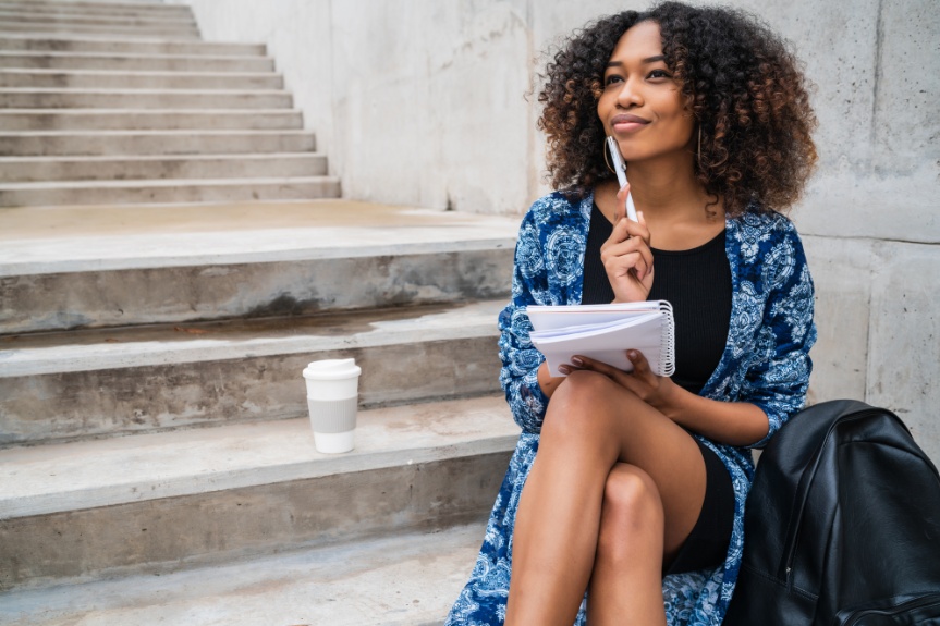 afro-american-woman-with-notebook-and-pen
